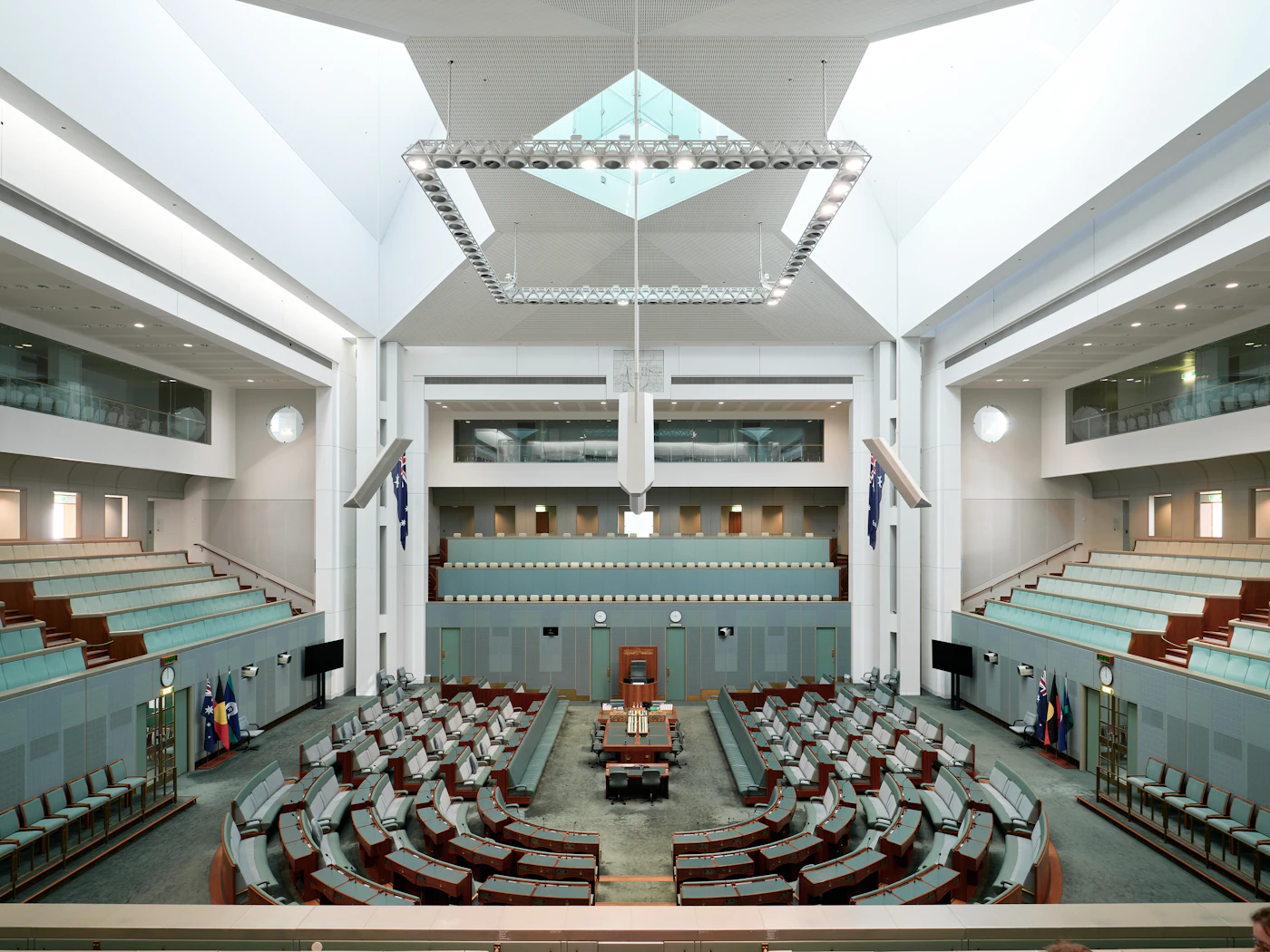 Empty parliamentary chamber arranged around a central floor